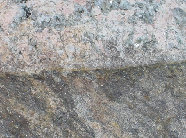 contact metamorphism -- an igneous/granitic side and a gneiss side. The granitic side includes pink feldspar and some large quartz crystals by Jack Carlson